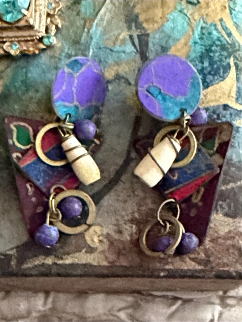 Clip style earrings artist made abstract metal pieces with attached panels